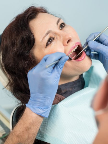 close-up-of-beautiful-senior-woman-having-dental-check-up-in-dental-picture-id678723656